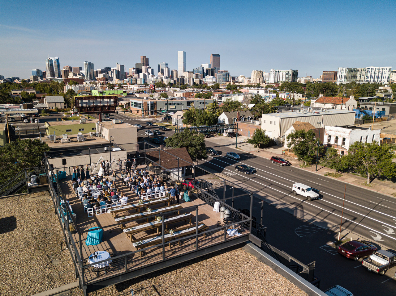 Rooftop wedding on the Battery621 deck with the Denver skyline behind