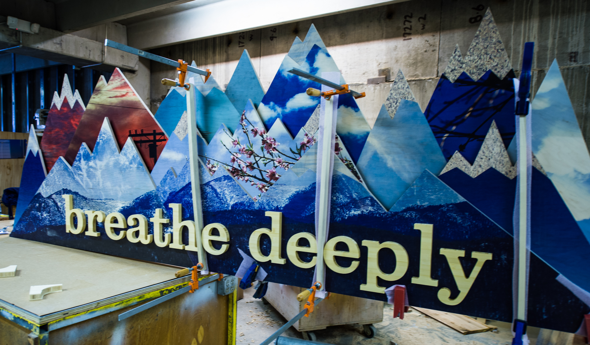 lululemon 'breathe deeply' mountain wall under construction in the shop
