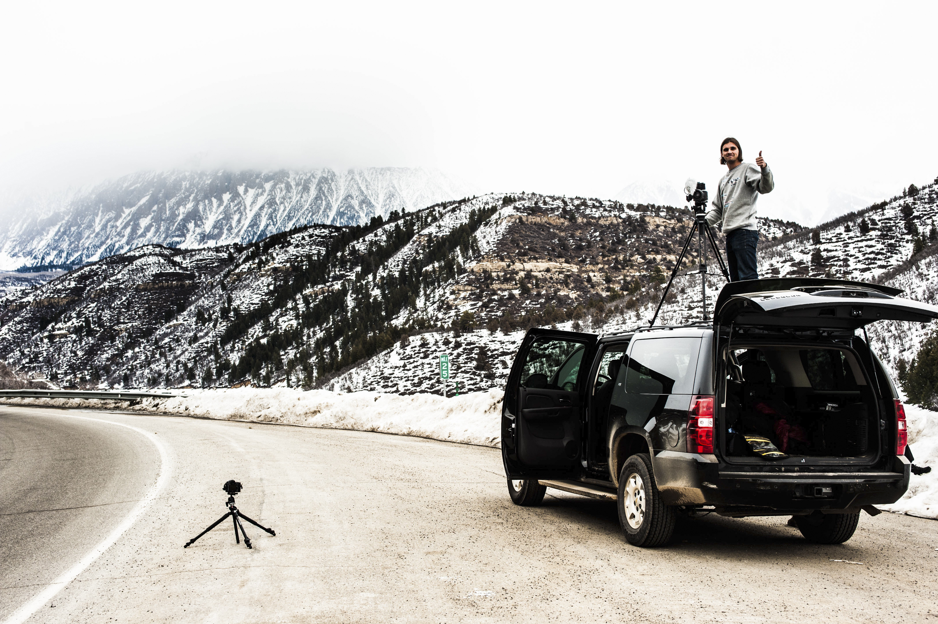 Camera rig on a vehicle roof in the snowy mountains