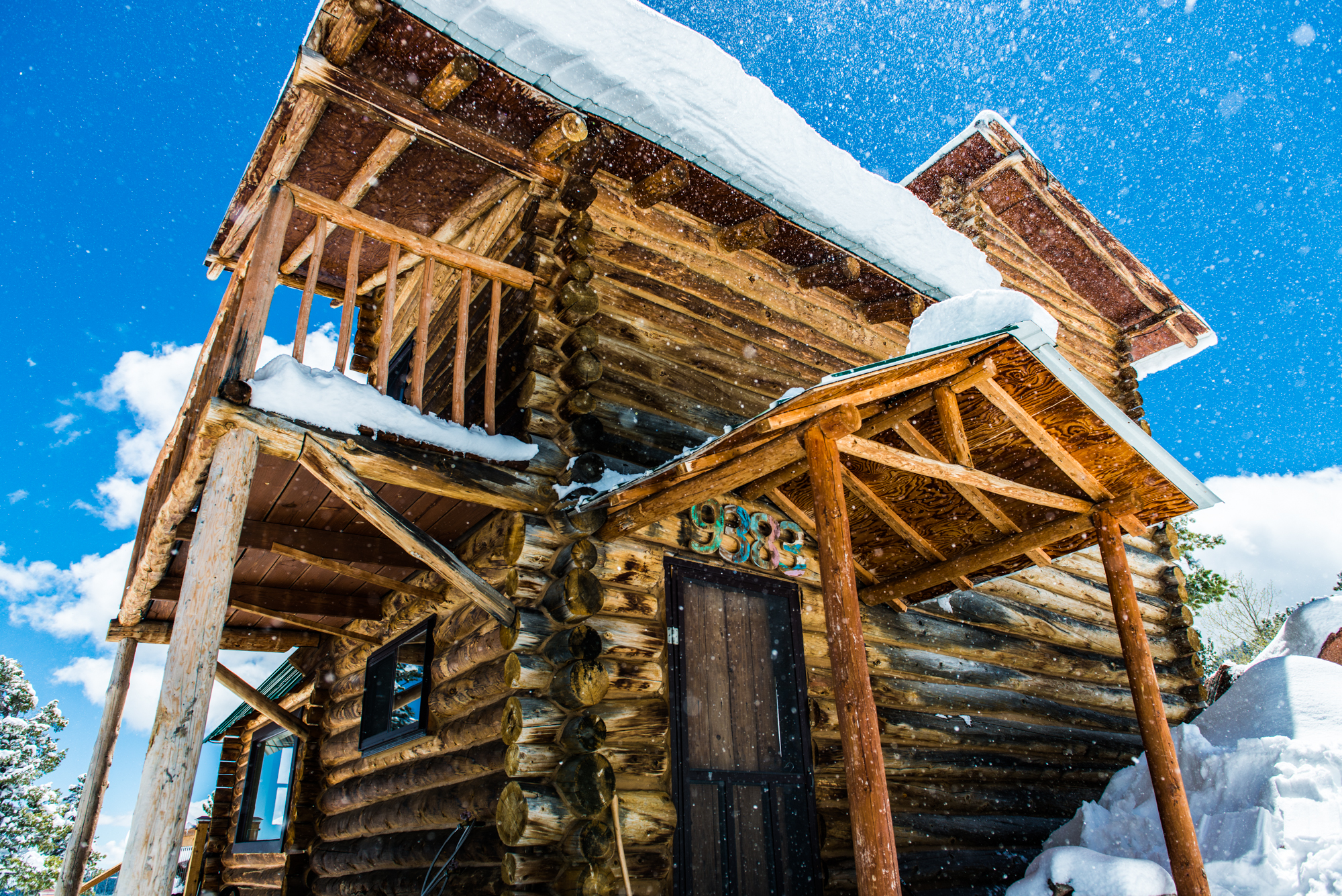 Cabin exterior in falling snow